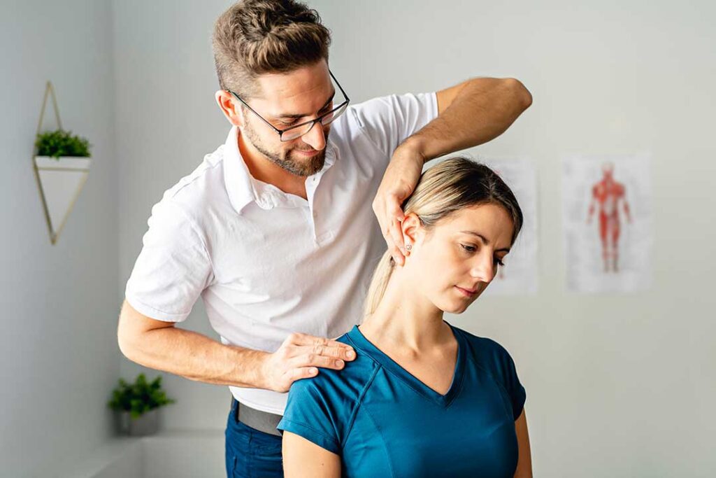 Chiropractor and massage therapist demonstrating different hands-on techniques for back and shoulder discomfort.